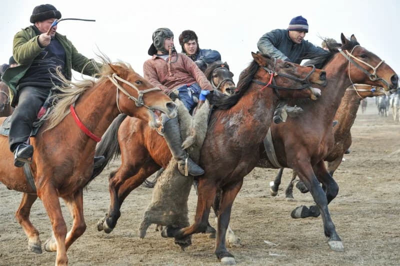 Men Competing in Traditional Kokpar Match