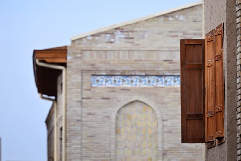 Traditional Wooden Window and Brick Building
