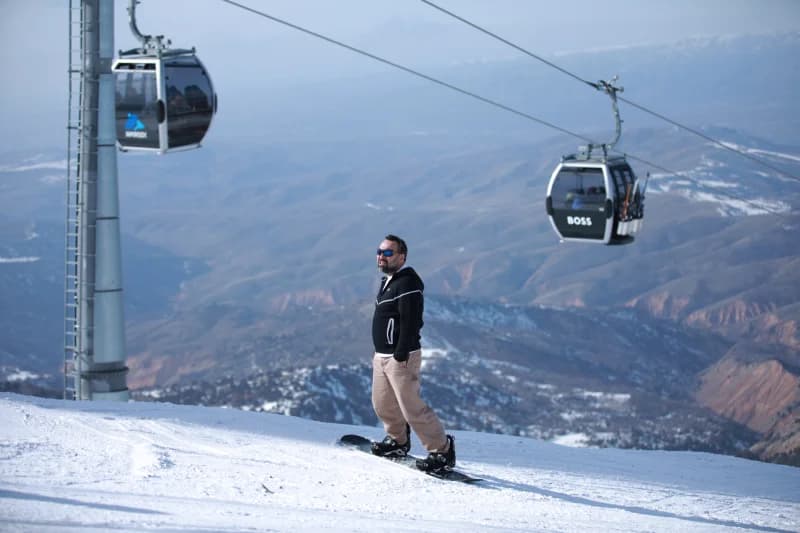 Snowboarder at Amirsoy Mountain Resort