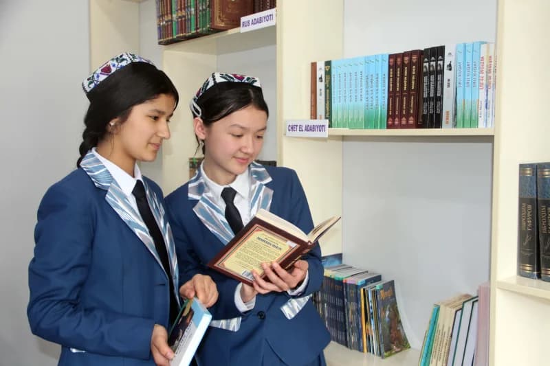 Students reading books in school library