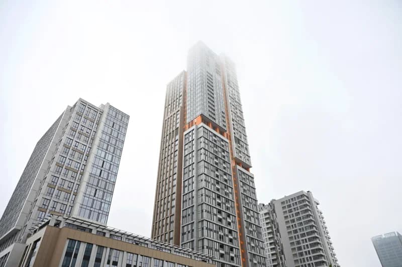 Modern high-rise buildings in thick fog