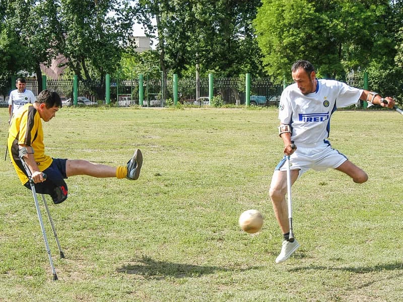 Amputee athletes playing football match