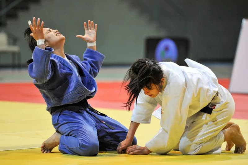 Female Judokas Competing on Mat
