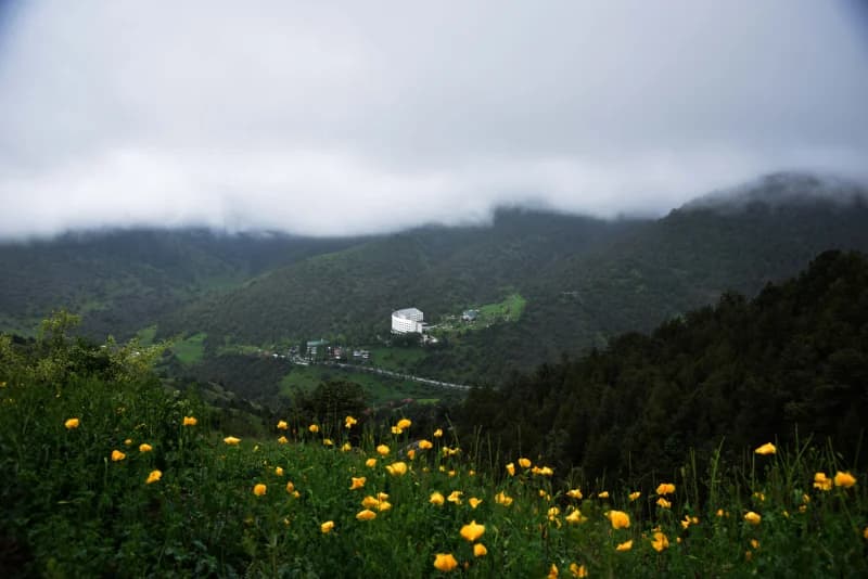 Mountain resort in cloudy landscape