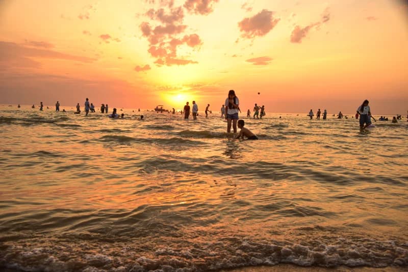 People enjoying sunset at the beach