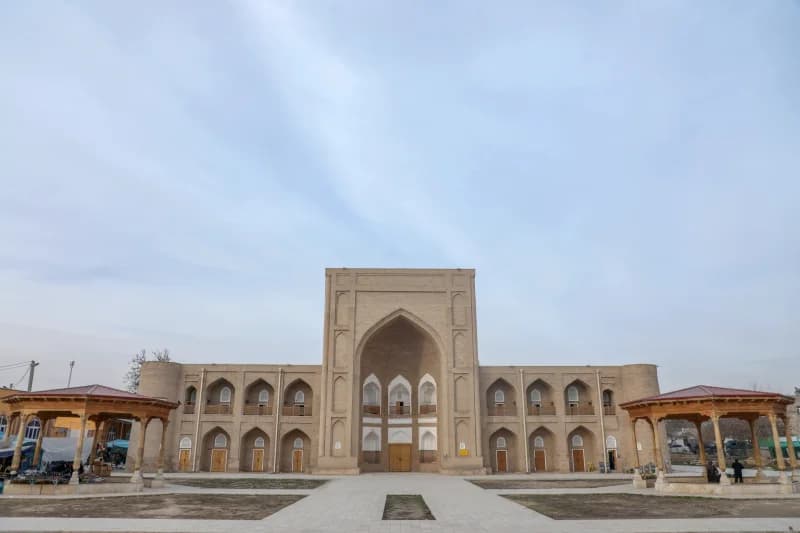 Sunlight illuminates historic brick madrasa