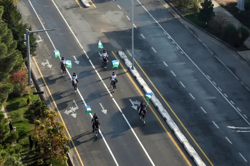 mounted guards ride along road