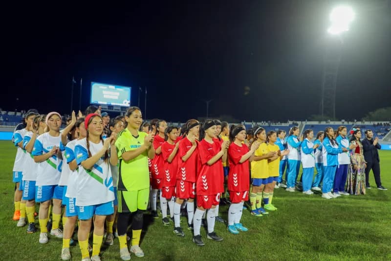 female football players applaud together