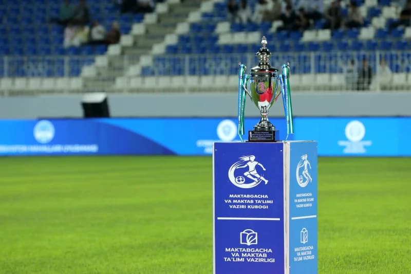 shiny trophy stands on pedestal
