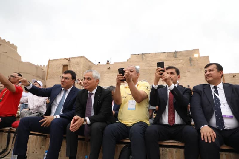 Officials watch performance at event