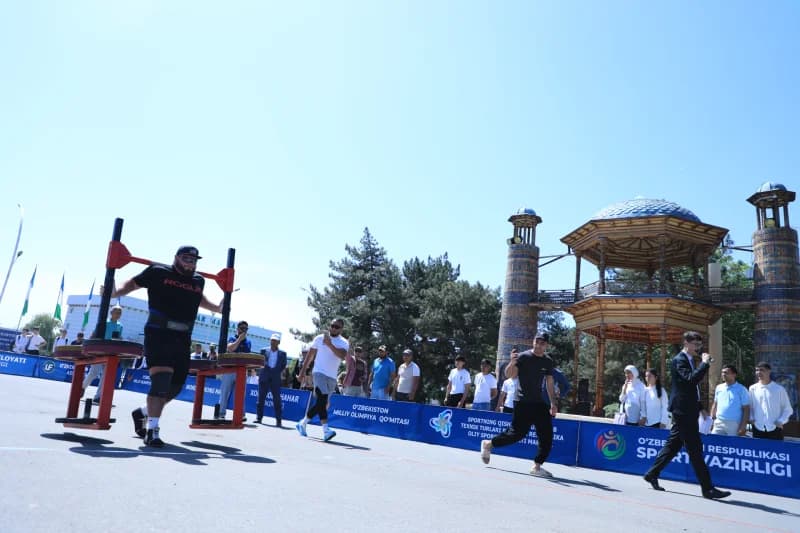 Strongman carries heavy metal frame