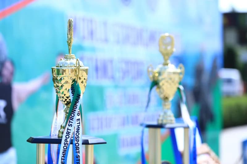 Gold trophies stand for competition