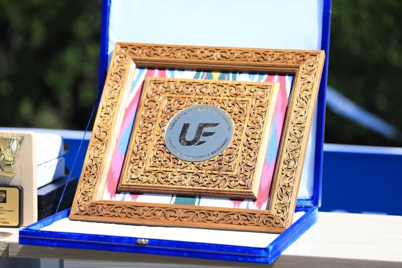 Wooden plaque displays association emblem