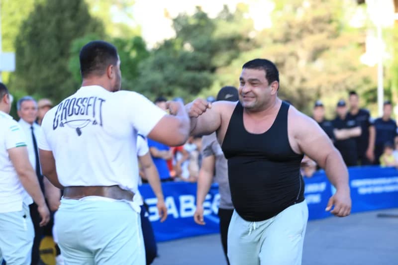 two athletes bumping their fists