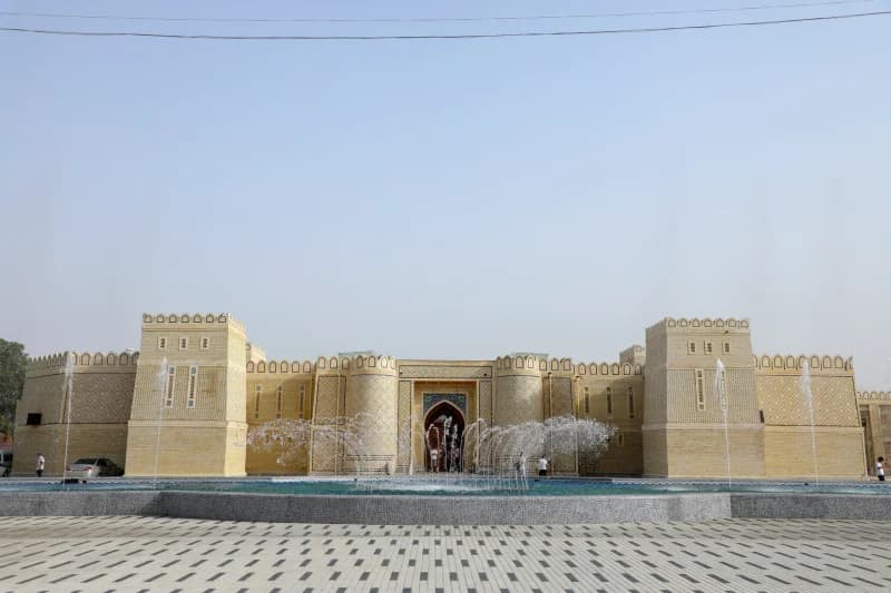 Fountains spray before historic fortress