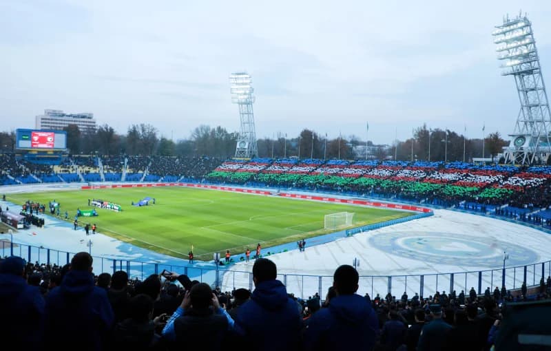 Fans display flags at stadium