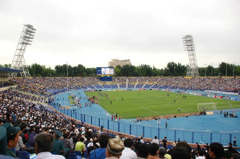 Spectators fill large outdoor stadium