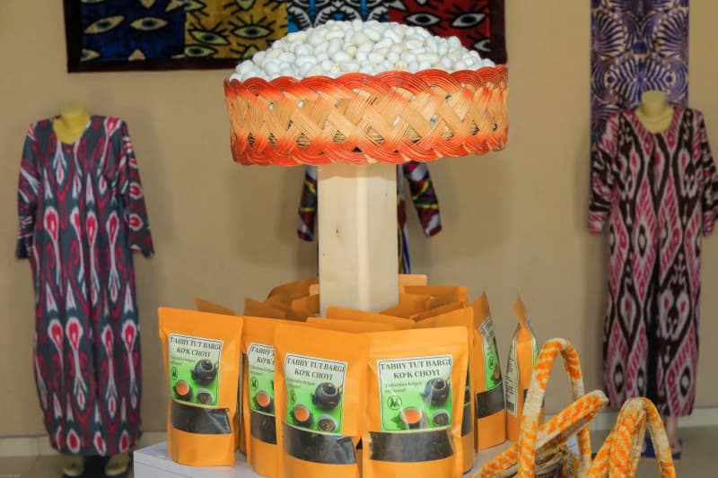 displaying silkworm cocoons and tea