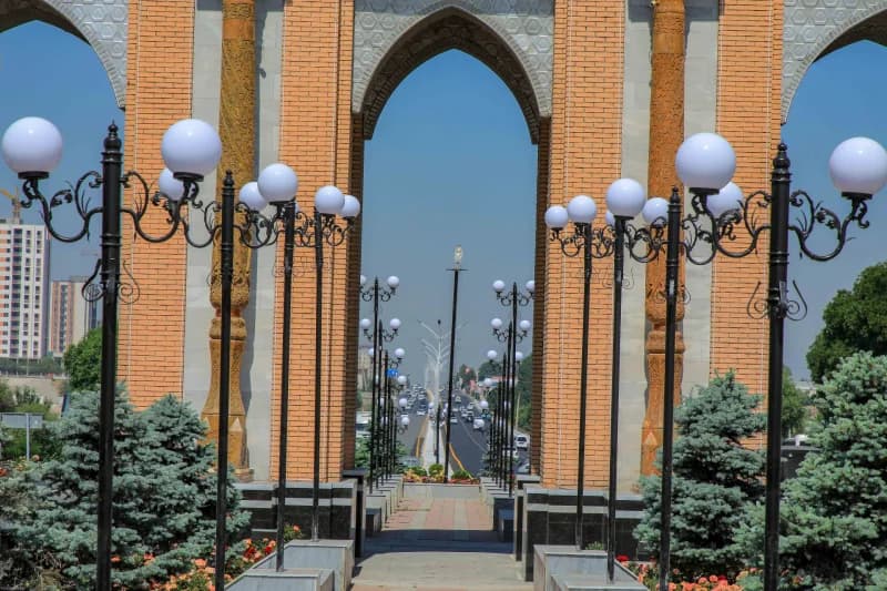 Street lamps frame city archway