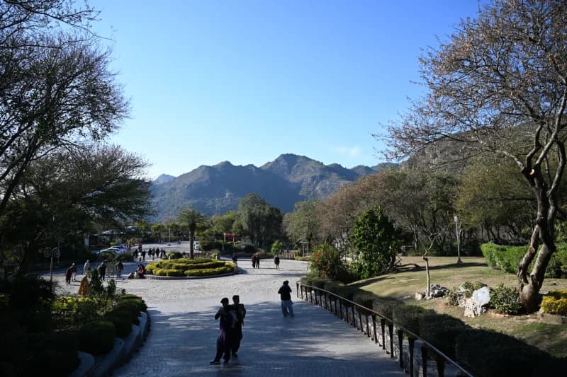 People walk through mountain park