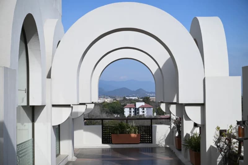 white arches frame distant mountains