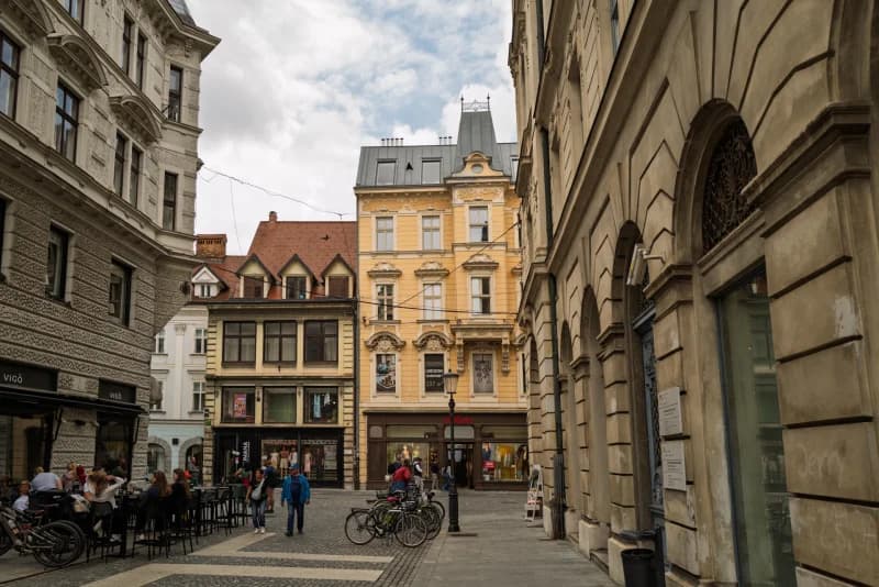 People walking through city square