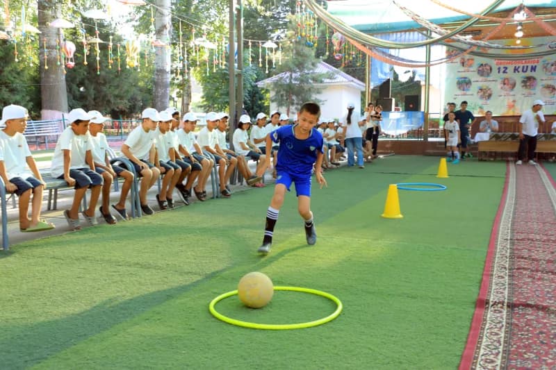 Young boy practicing soccer skills