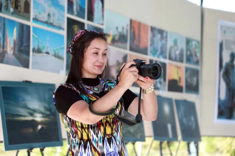 Woman captures photos at exhibition