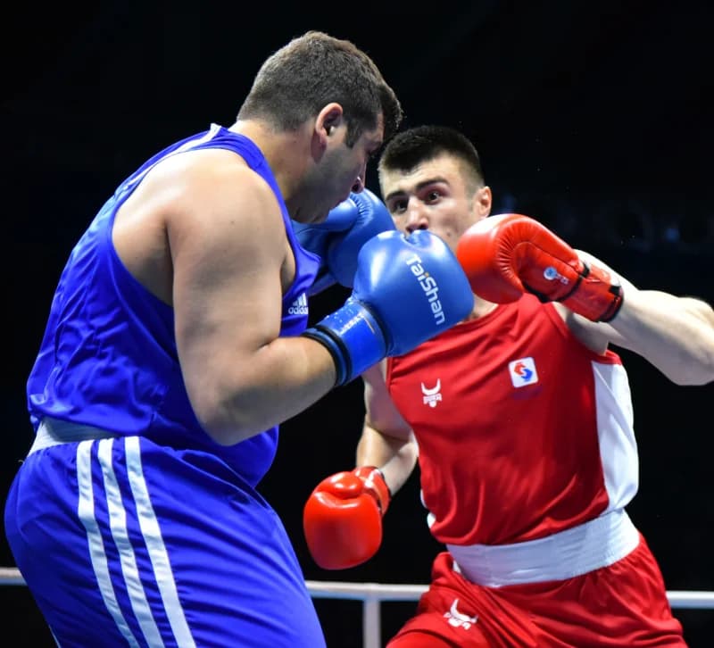 Two boxers competing in ring