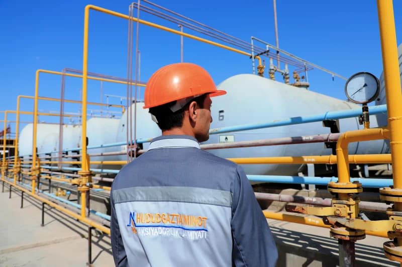 worker monitoring industrial gas pressure