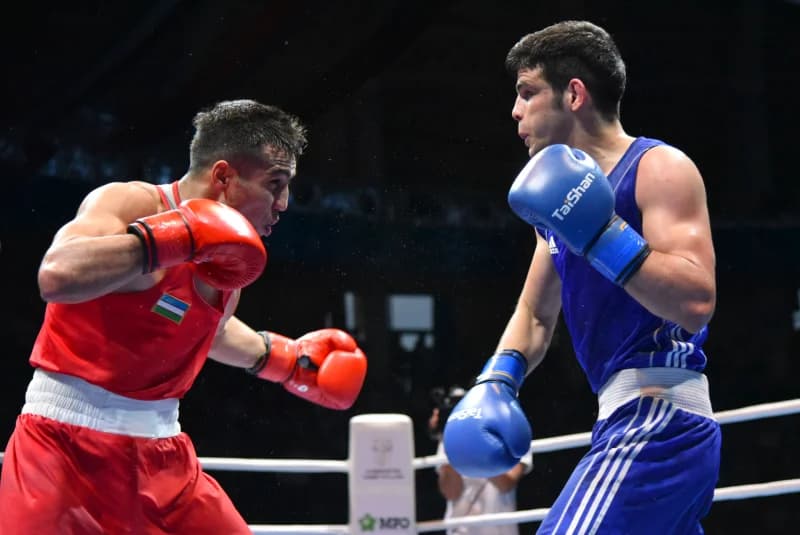 Two boxers competing in ring