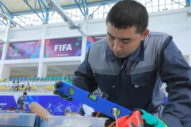 Technician checks level in stadium