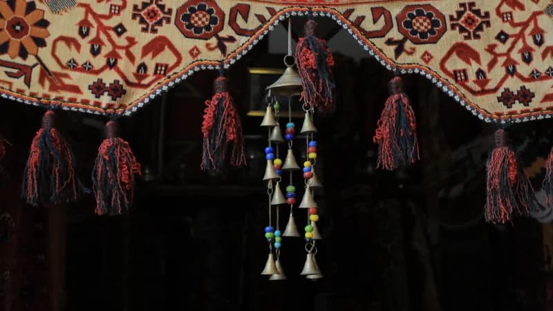 Small metal bells hanging indoors