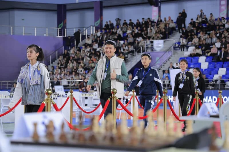 Young participants walk through arena