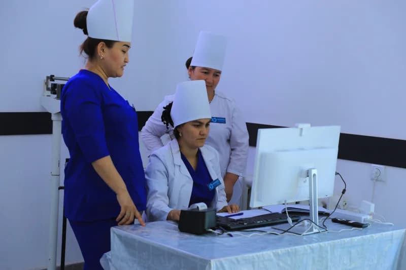 Medical staff reviewing patient data