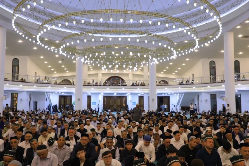 Men gather inside large mosque