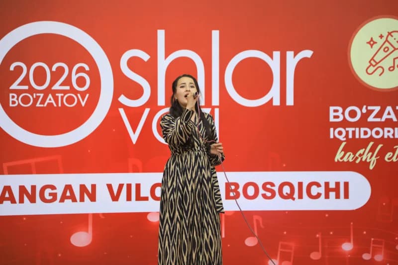 Young woman singing on stage