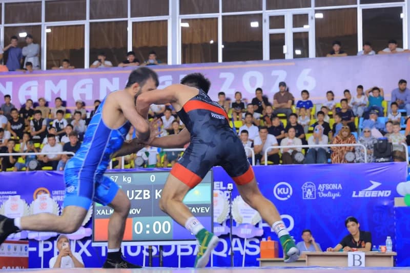 Wrestlers competing on the mat