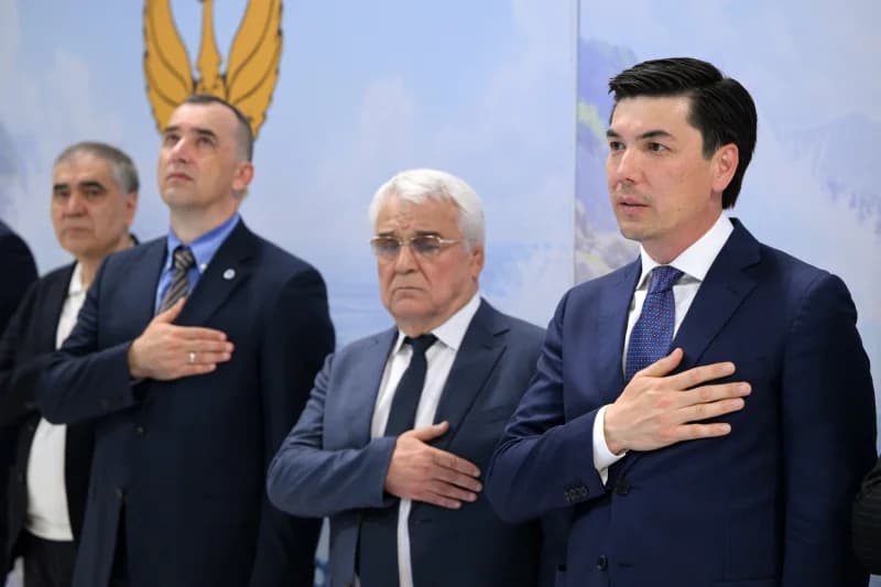 men standing with hands placed