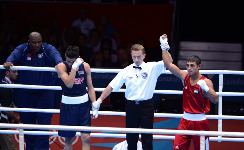 Referee declares winner of match
