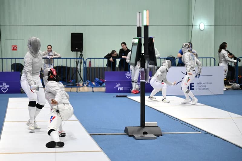 female athletes competing in fencing