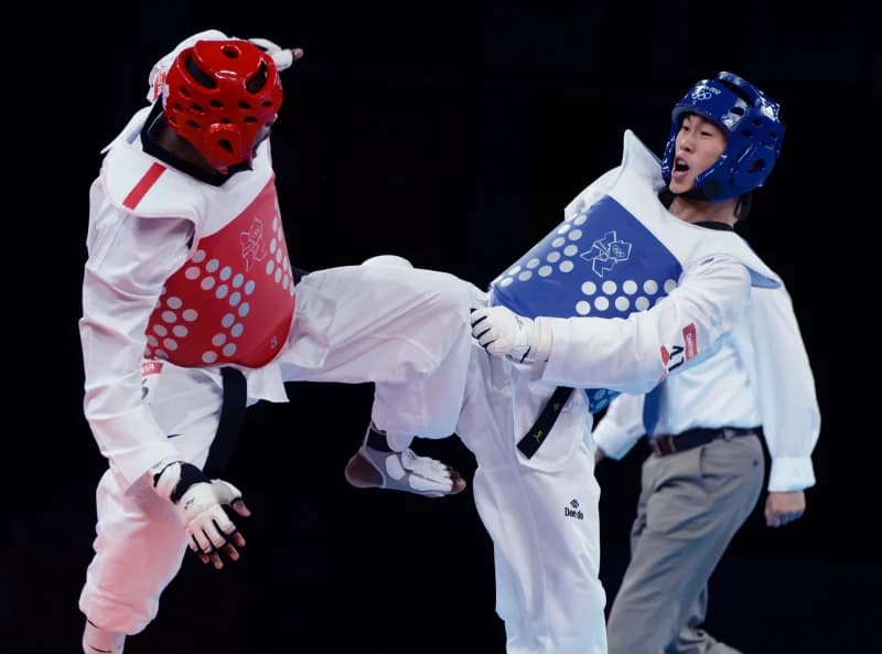 Taekwondo athletes competing in match