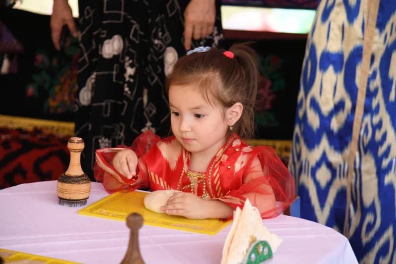 young girl preparing traditional dough