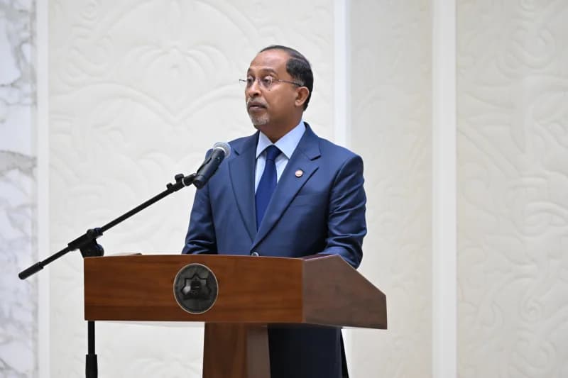 Official delivers speech at podium