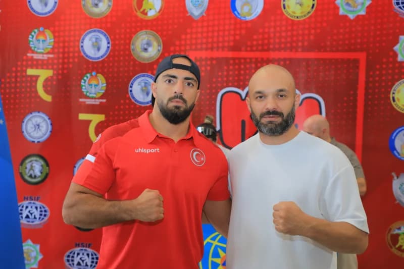 two men posing with fists