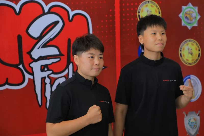 two athletes posing for photo