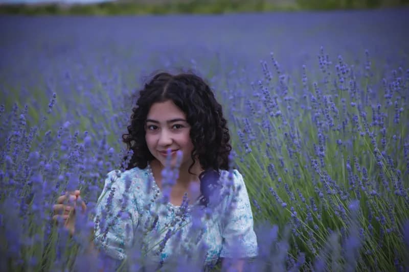 Young woman posing in lavender