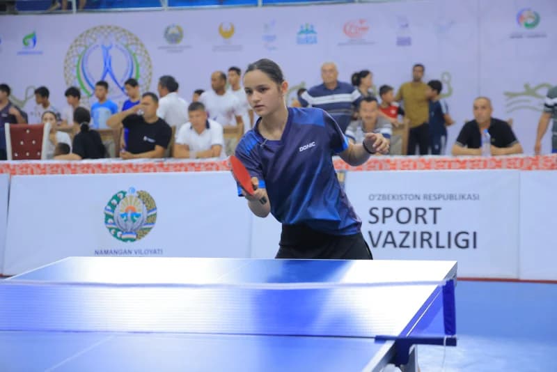 Young athlete playing table tennis