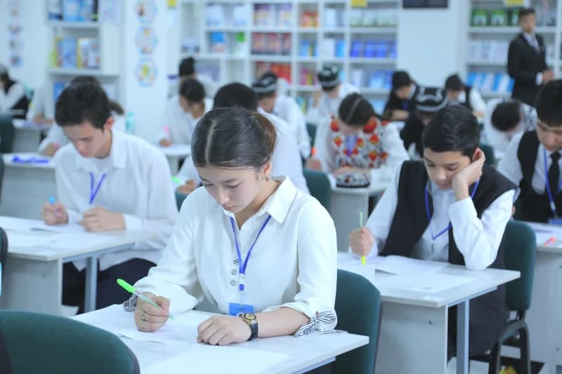 Students taking a written exam