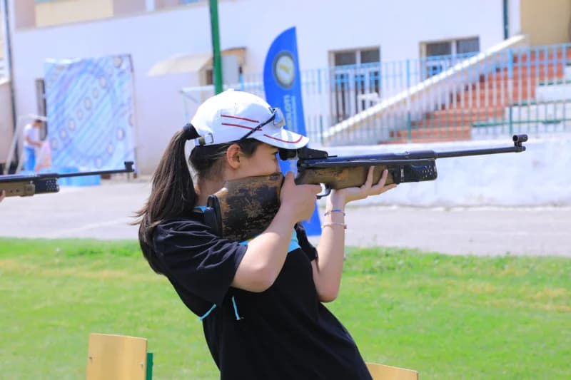 Young woman practicing air rifle